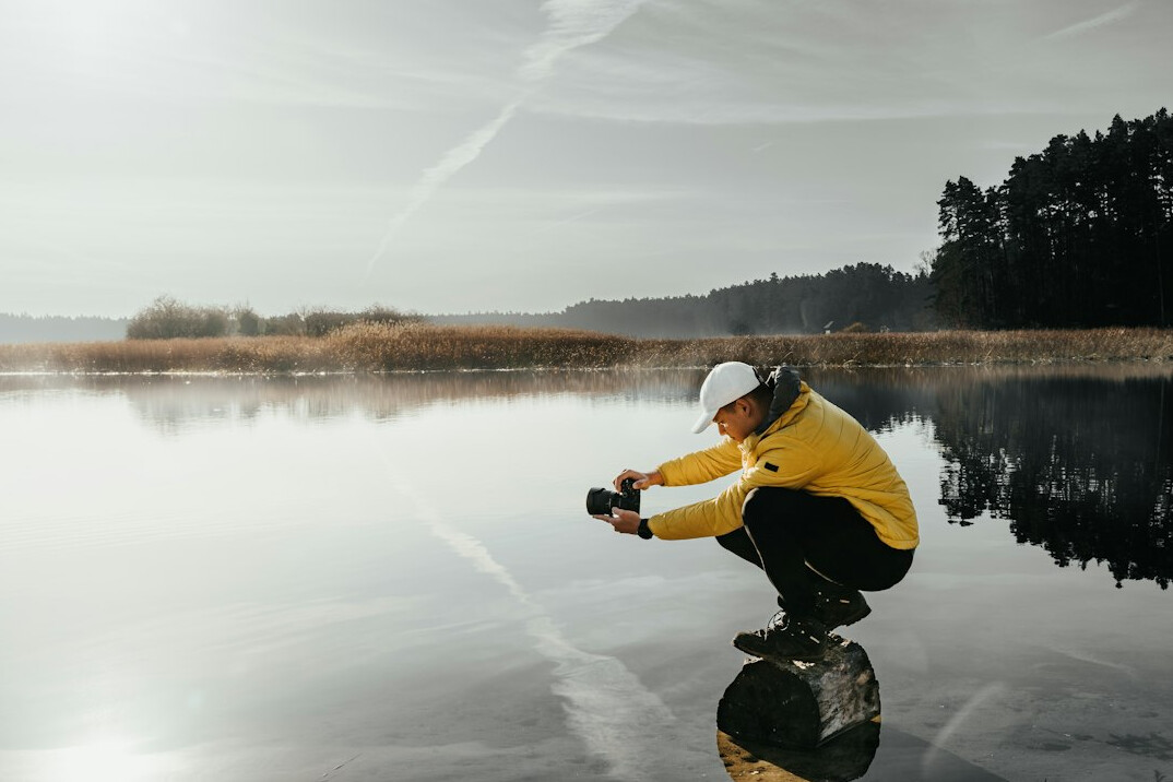 Portrait of a Polish male documentary photographer with a camera