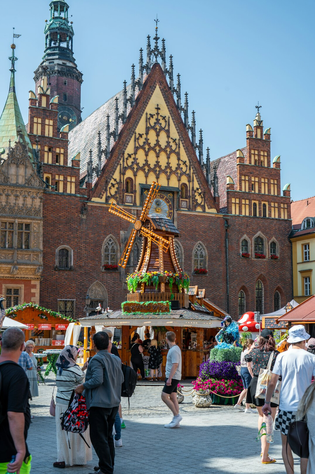 Local market square with vendors and residents trading goods in Poland