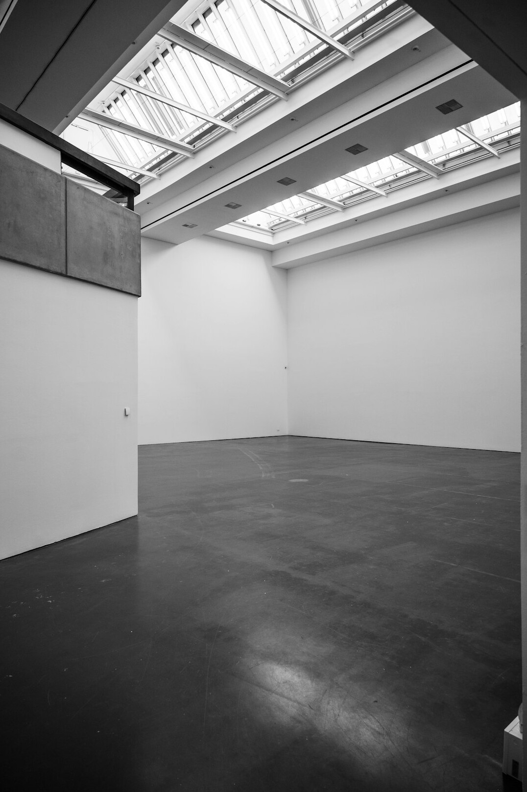 Exhibition hall with framed documentary photographs on white walls